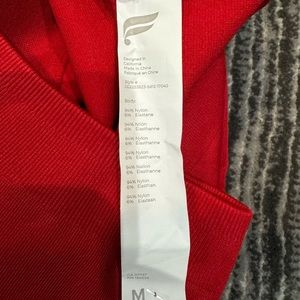 NWT Fabletics red size M leggings with cut out design.
